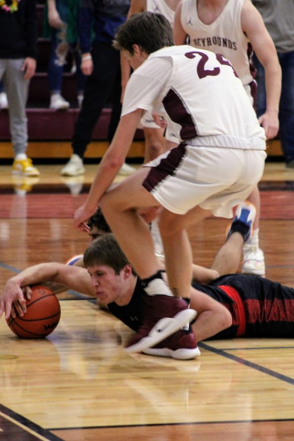 Forward Jack Ballard dives for a loose ball in the first half